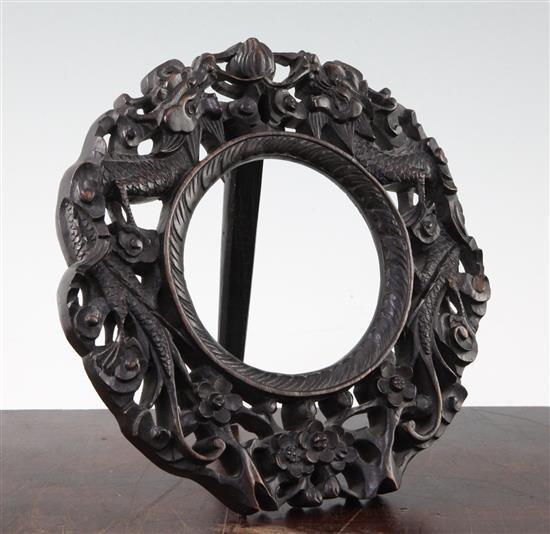 A Chinese rosewood circular easel photograph frame, late 19th century, 20.5cm, back panel lacking